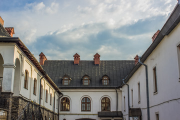 Obraz premium medieval monastery yard in bright day with blue sky