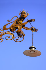 Fototapeta na wymiar street lamp in the form of a monkey