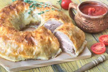 Meatball Wellington ring with tomato sauce