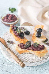 Toasts with black olive pate