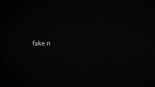 fake news, text typing on laptop screen, 4K seamless loop glitch animation