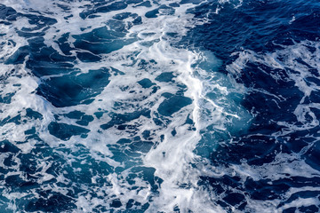 Fototapeta premium Natural background of blue foam sea water.