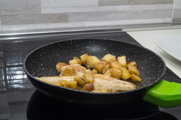 sea bass cooks with potatoes