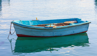 Fototapeta na wymiar Small fishing boat at the port of Marsaxlokk, Malta. Closeup view