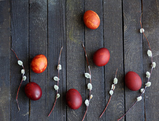 red Easter eggs on dark wooden background
