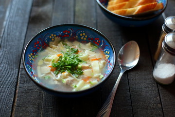 soup lagman on wooden background