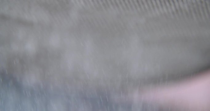 Sifting flour in slow motion