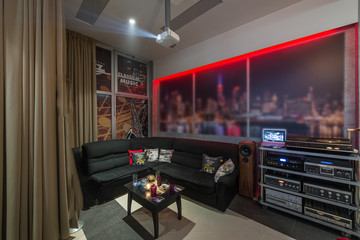 Sound system and corner sofa in living room intrerior