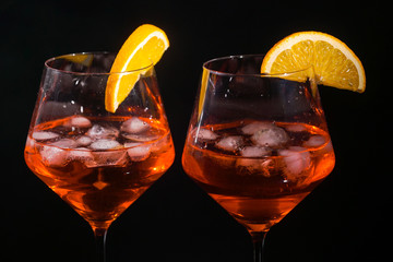 Pair of glasses with alcoholic drink beverage wine cocktail black background isolated