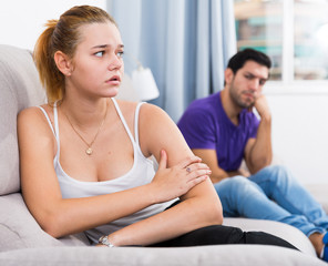 Woman on sofa after quarrel with husband