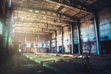 Abandoned ruined industrial factory building, corridor view with perspective, ruins and demolition concept