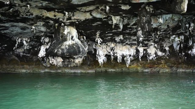 stalactites at the foot of islands in the ocean.