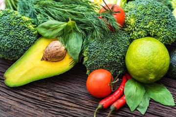 Fresh vegetables, lime and avocado close