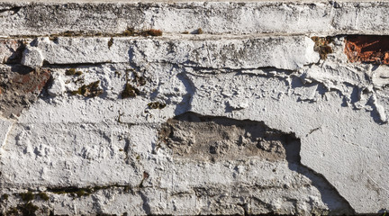 Fototapeta premium Photo of an old wall with an old brick. Horizontal. Close up