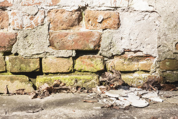 Photo of an old wall with an old brick. Horizontal. Close up