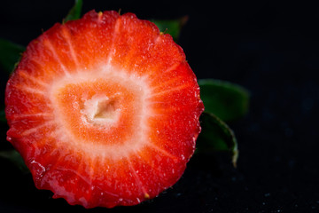 Strawberries in a section on a black background