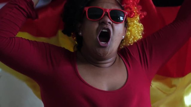 German Woman Celebrating with National Flag