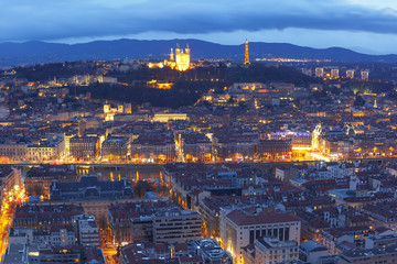 Fototapeta na wymiar Aerial view of Old town with Fourviere cathedral during evening blue hour in Lyon, France