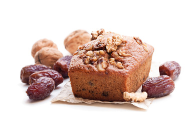 Homemade  date and walnut loaf cake isolated on white