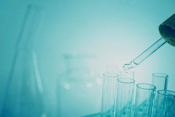 Laboratory pipette, science laboratory, doctor, science research concept,  test tube on blue background
