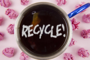 Conceptual hand writing showing Recycle Motivational Call. Business photo showcasing Convderting waste into reusable material written on Tea in Cup within Paper Balls on plain background.