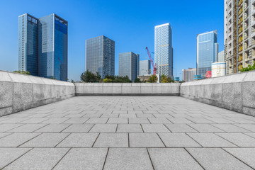 Panoramic skyline and buildings with empty square floor.