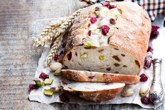Homemade  mixed fruit and nut white bread on wooden table
