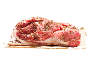 Fresh  pork shoulder joint with caraway seeds isolated on white