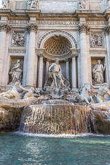 Famous landmark fountain di Trevi close up front view of facade and statues in Rome, Italy