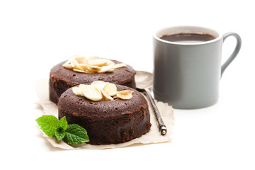 Chocolate  fondant with almonds and cup of coffee isolated on white