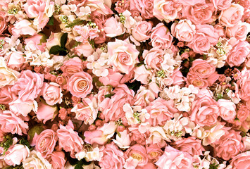 Pink rose flowers bouquet background for Valentine's Day decoration, top view.
