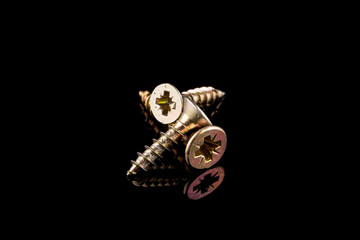 Screws on black background