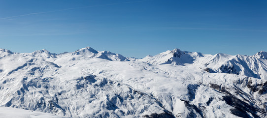 Fototapeta na wymiar Landscape French Alps after a snowfall, Haute Savoy, France. White mountain and blue sky.