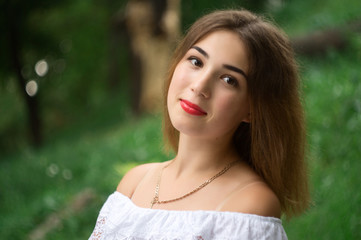 Naklejka premium Beautiful model in a white summer dress