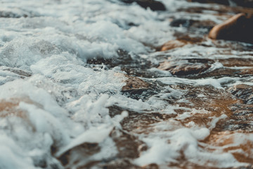 Beautiful rocky shore of the beach with waves crashing. Lazy beach, Koh Rong Sanloem. Vintage style filter  © stockcrafter