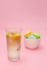 Iced coffee latte on wooden table with Colorful Macaroons
