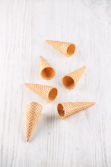 ice cream cones on a wooden background