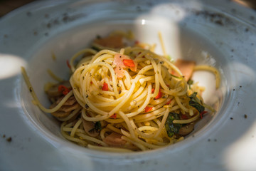 Home made style spaghetti on white ceramic plate