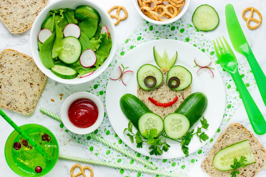 Healthy sandwich for kids, frog sandwich from whole wheat bread and cucumber