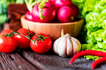 Fresh seasonal vegetables on wooden surface