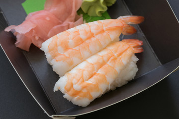 Sushi: takeaway set of prawn nigiri with ginger and wasabi