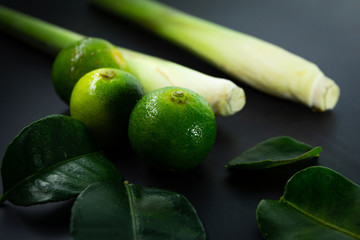 Lime and lemongrass in black background