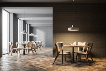 Interior of a gray brick loft cafe, blank wall