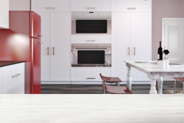 Luxury kitchen with marble table, red fridge blur