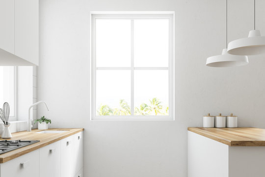 White kitchen with a window