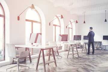 Side view of a modern open space office, man