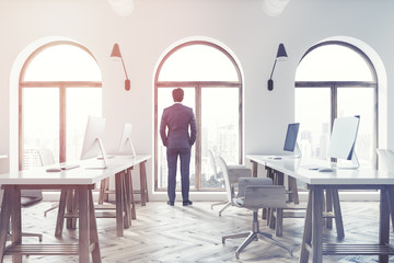 Side view of an open space office, businessman
