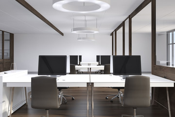 Front view of an open space office, dark