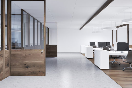 White open space office, wooden doors