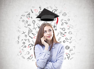 Dreamy young woman in a blue shirt, education